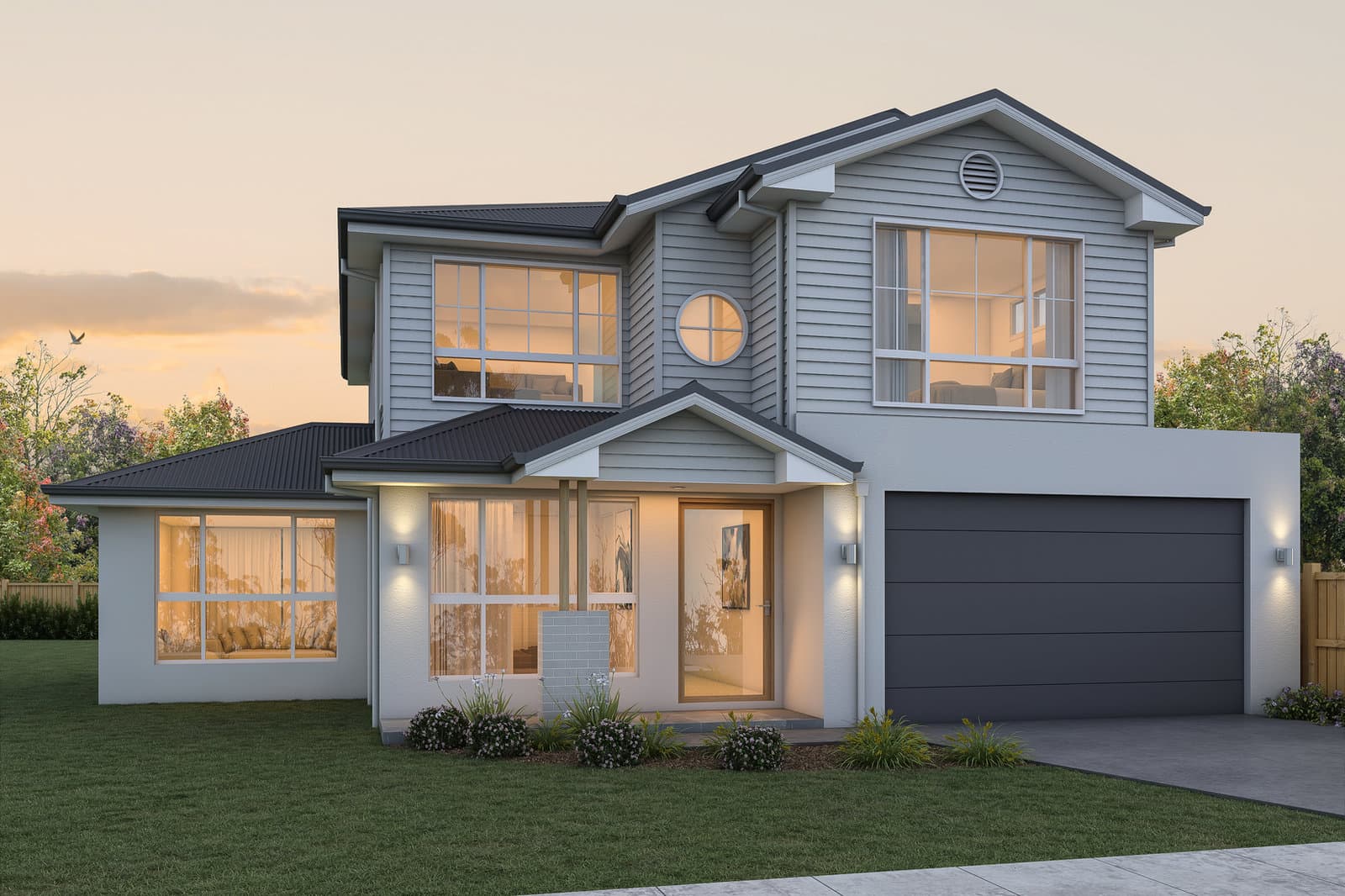 Two-storey home lit from inside at dusk